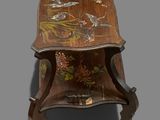 a wooden table with a floral design on it