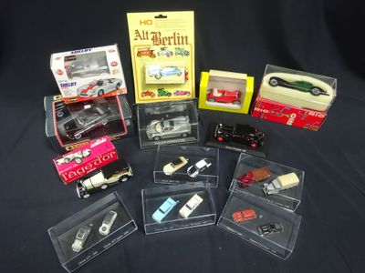 many different types of toy cars in a display case