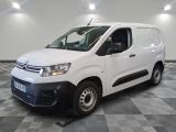 the white van is parked on a checkered floor in a room
