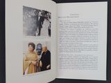 an open book with pictures of people on it