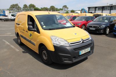 a yellow van that is parked in a parking lot