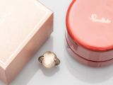 a pink box with a ring inside of it and a pink box with a ring inside of it