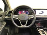 the interior of a car with a steering wheel and dashboard controls