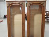 pair of antique wooden display cabinets with glass doors