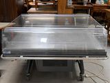 a glass display case that is sitting on top of a table