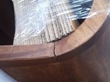 a wooden bowl with a brush in it that is wrapped in plastic