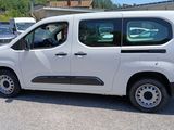 a white van that is parked in a parking lot