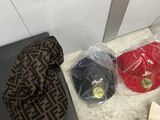 a purse, a hat, and a book on the floor