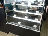 a display case with a variety of food items in it