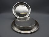 an antique silver plate with a domed lid on a stand