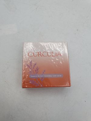 an image of a box of perfume sitting on top of a table