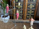 three figurines that are on display in a glass case