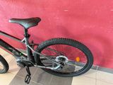 a bicycle that is parked against a wall
