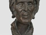 bronze bust of a woman on a marble base