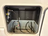 an image of the inside of a vehicle with a gas tank