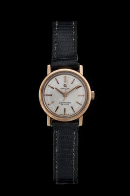 a close up of a watch on a black background