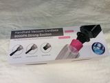 packaging of a vacuum cordless vacuum in a box on a white surface
