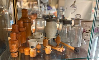 a glass display case with many different items in it