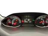a close up of a car dashboard with a speedometer and gauges