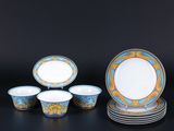 an image of a group of blue and gold plates and bowls