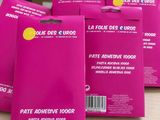 four packs of face masks on a table in front of boxes