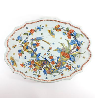 a plate that has a bird design on it