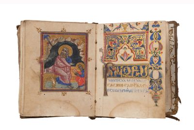 an open book with a picture of a woman and a child on it