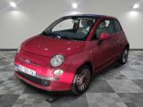 la photo d'une petite voiture rouge garée dans un garage