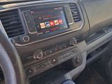 a car dashboard with a steering wheel and a dash board