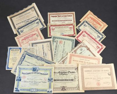several old and new certificates are arranged on a black surface