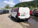 a white van that is parked in a parking lot