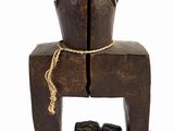 a small wooden toy that is sitting on a chair