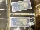 several different types of currency are in a case on a table