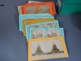 many old photos of a building on the table