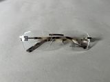 a pair of glasses that are laying on a table