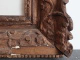a picture of a wooden frame with carvings on it