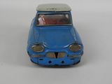 a blue toy car that is sitting on a table