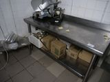 a large metal table with a bunch of boxes on top of it