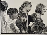 black and white photograph of a group of people with faces painted on them