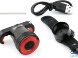 a close up of a bicycle light and a usb charger