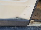 a close up of a car ' s bumper with a number plate on it