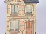 une petite maison de poupées avec un toit bleu et une porte rouge