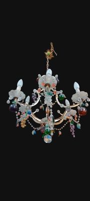 a chandelier with a bird on top of it