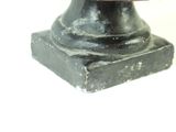 a statue of a man with a hat on top of a pedestal