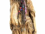 statue of a woman with a wreath of flowers on her head