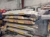 a large pile of metal and wood in a warehouse