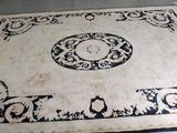 a black and white rug on the floor in a room