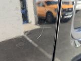 a reflection of a car in the side mirror of a car