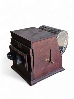 a small wooden box with a fan on top of it