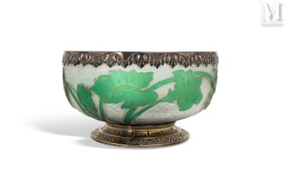a green and white bowl sitting on top of a table